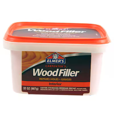 Elmer’s Carpenter’s Interior Wood Filler 32 oz (E842L) by Elmer's is a plastic container with a red lid and label, designed for repairing wood holes and gouges indoors—ideal for carpentry and wood repairs.