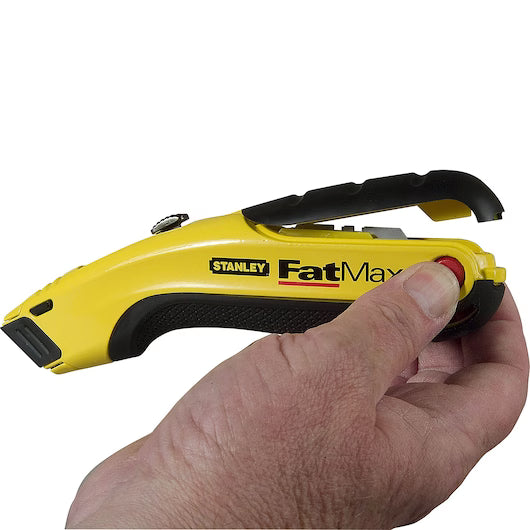A hand grips a STANLEY® FATMAX® Retractable Utility Knife, with the thumb pressing its red button on this durable yellow and black cutting tool by STANLEY.