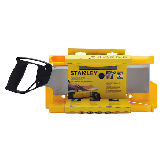 The STANLEY® Clamping Mitre Box with Saw features a yellow box, black-handled saw, and visible STANLEY branding on the label; the saw blade fits in the box for precise woodworking.