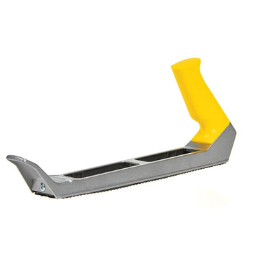 The STANLEY 10 IN SURFORM® PLANE TYPE REGULAR CUT BLADE is a handheld tool with a flat, textured blade and yellow angled handle, ideal for shaping or smoothing wood or drywall surfaces.