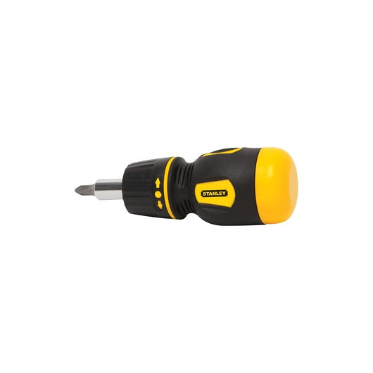 The STANLEY STUBBY RATCHETING SCREWDRIVER features a black and yellow ergonomic handle, Philips head bit, and ratcheting mechanism, displayed against a plain white background.