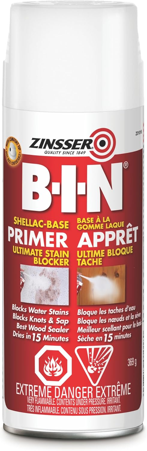 A 369g can of Zinsser B-I-N Shellac-Based White Interior Primer and Sealer with a red label, English and French text, highlighting stain sealing, smoke odor blocking, knots sealing, 15-min dry time, and an extreme danger warning.