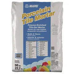 A 50 lb. bag of Porcelain Gray Thinset Tile Mortar by Go Build, The Fastest Way To Build, features BioBlock technology to resist mold and mildew. This polymer-enriched mortar is perfect for both walls and floors in interior and exterior projects, with a specified color of gray.