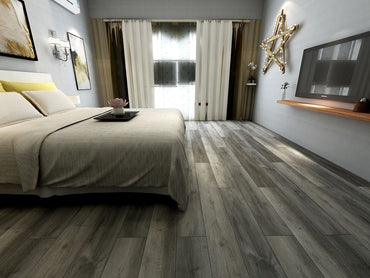 Modern bedroom featuring MSI Katella Luxury Vinyl Planks (23.77 sq ft box), a large bed with light bedding, wooden floors, wall-mounted TV, window curtains, a star-shaped wall light, and a flower tray on the bed.