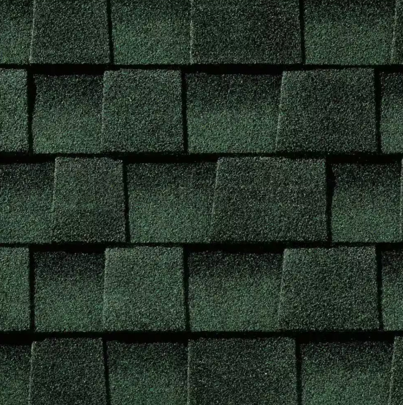 Close-up of GAF Timberline HDZ 33.33 sq. ft. Per Bundle Laminated High Definition Shingles in dark green, showcasing their textured, overlapping pattern and advanced StainGuard Plus Algae Protection from GAF.