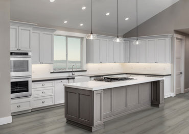 Modern kitchen with white cabinets, gray island, stainless steel appliances, and pendant lights. Features MSI XL Cyrus Brianka Luxury Vinyl Planks (22.44 SQFT/box) for waterproof flooring and recessed ceiling lights plus a large window.