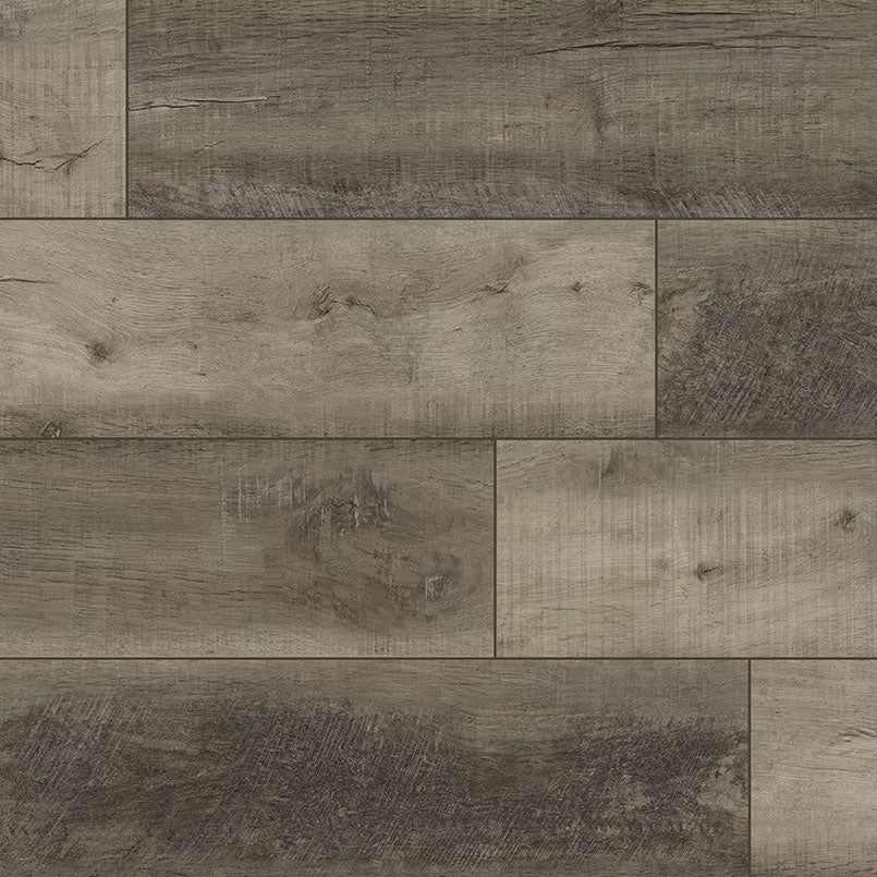 A close-up of MSI XL Cyrus Wolfeboro Luxury Vinyl Planks (22.44 SQFT/box) in gray and brown, showing rustic wood grain, knots, and texture in a staggered layout.
