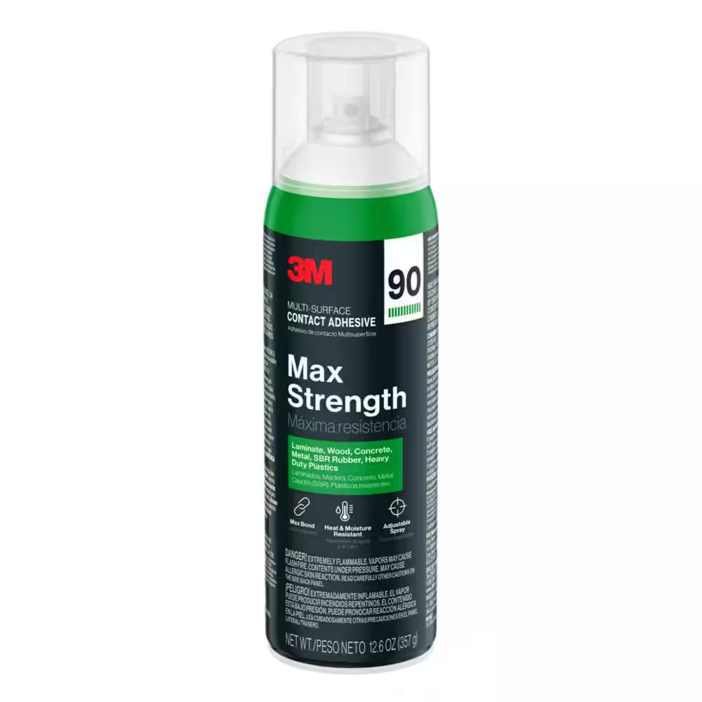 A 12.6 oz. can of 3M Max Strength Contact Adhesive, an industrial-strength spray for laminates, wood, concrete, plastics, and more. The mostly black can has green and white accents with a clear spray nozzle cap.