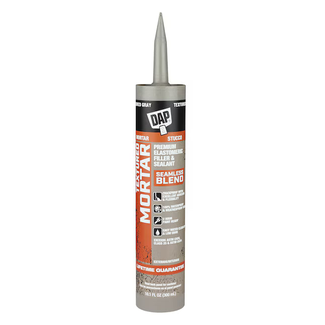 A 10.1-oz tube of DAP Premium Textured Mortar Exterior and Specialty Gray Paintable Acrylic Urethane Elastomeric Sealant Caulk, ideal for crack sealing or as a mortar filler, features an orange label and nozzle for easy application.
