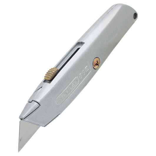 The STANLEY® 99E Classic Retractable Blade Utility Knife features a silver metal body, a brass-colored thumb slider on top, and a partially extended blade.