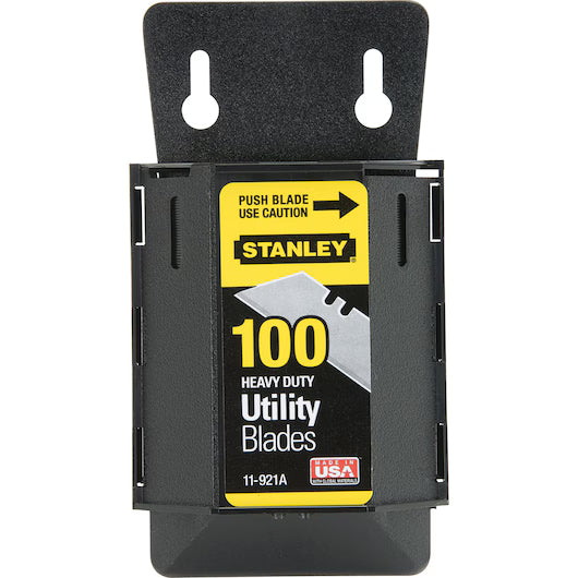 A black dispenser holds 100 STANLEY 1992® Heavy-Duty Utility Blades, with a yellow and black label that reads: Push Blade Use Caution. STANLEY. 100 Heavy Duty Utility Blades. Made in USA.