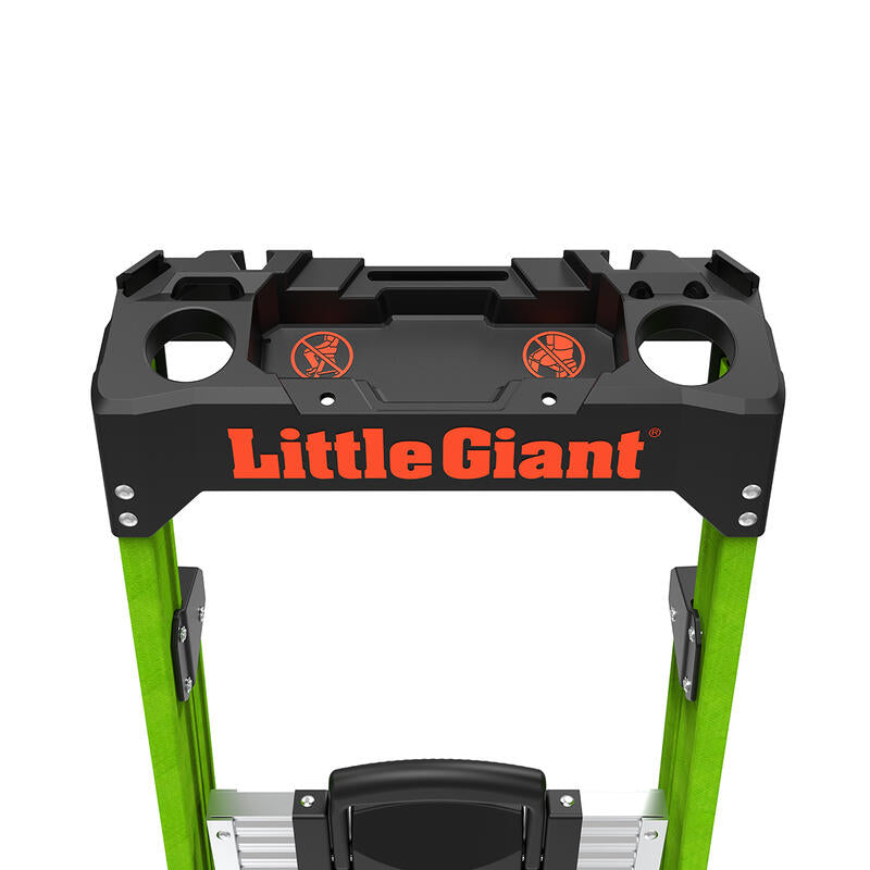 Close-up of the top section of a LITTLE GIANT 15396-001 MightyLite IA 6 ft. fiberglass stepladder, featuring a black tool tray with orange LITTLE GIANT text, circular slots, warning labels, and a 300 lb load capacity.