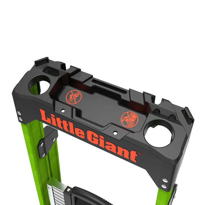 Close-up of the top section of the LITTLE GIANT 15398-001 MightyLite IA 8 ft. 300 lb. Fiberglass Stepladder, showing a black tool tray with cup/tool holders and bold orange LITTLE GIANT branding.