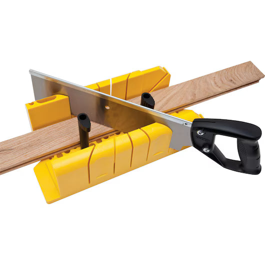 A STANLEY® Clamping Mitre Box with Saw from STANLEY guides the saw to cut wood at an angle, ensuring precise and accurate woodworking.