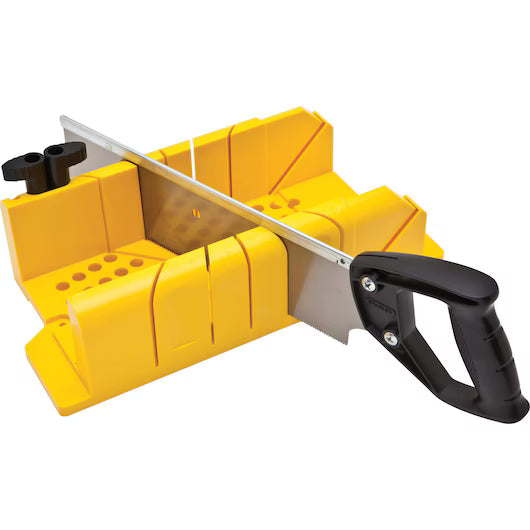 The STANLEY® Clamping Mitre Box with Saw features angled guide slots and a black-handled saw, making it an ideal precision cutting tool from STANLEY for accurate angled cuts in wood or similar materials.