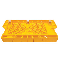 A yellow plastic queen excluder with round holes and three white clips fits beehive frames—perfect for those who value precise tools like the STANLEY® Clamping Mitre Box with Saw by STANLEY.