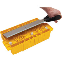 A hand uses the STANLEY® Clamping Mitre Box with Saw to achieve precise and accurate cuts, demonstrating the reliability of this STANLEY cutting tool.