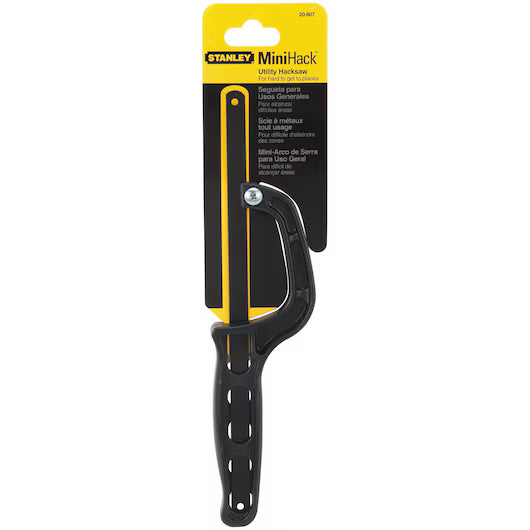 The STANLEY® Mini Hacksaw by STANLEY features a black handle and comes in yellow-and-black packaging, designed for cutting metal, and is shown upright in its unopened package.