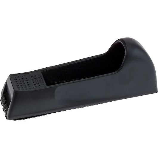The STANLEY 6 IN SURFORM® POCKET PLANE-inspired black plastic doorstop has a textured, non-slip surface and sloped design, ideal for wedging under doors to keep them open.