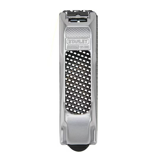 The STANLEY 6 IN SURFORM® POCKET PLANE is a silver woodworking tool with a black perforated grating surface, ideal for shaping and smoothing wood or plaster.