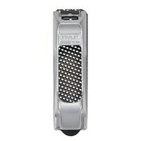 The STANLEY 6 IN SURFORM® POCKET PLANE is a silver woodworking tool with a black perforated grating surface, ideal for shaping and smoothing wood or plaster.