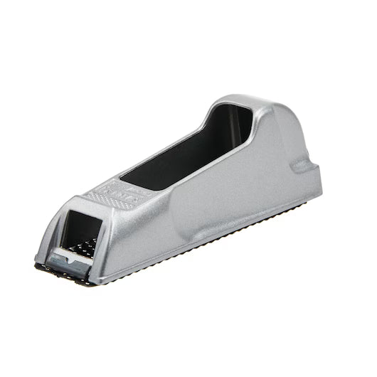 The STANLEY 6 IN SURFORM® POCKET PLANE is a compact metallic tool with a textured black grating, ideal for smoothing or shaping wood and other materials.