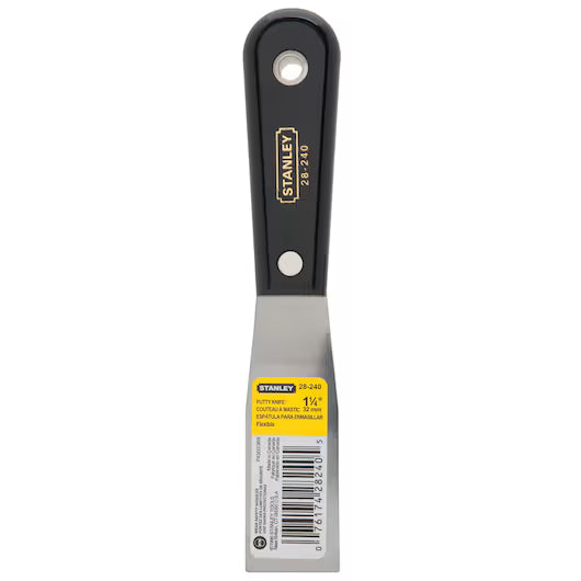 A 1-1/4 Stanley flexible putty knife with a black nylon handle and stainless steel blade, shown on a white background. The handle shows the Stanley logo, and a yellow label is on the blade—ideal for applying finishing compounds.