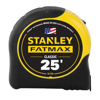 The 25 ft STANLEY® FATMAX® Classic Tape Measure features a durable black and yellow case, an American flag, and the label MADE IN USA WITH GLOBAL MATERIALS for dependable performance.
