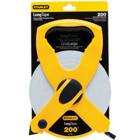 The STANLEY 1/2 in x 200 ft Open Reel Fiberglass Long Tape features a yellow and black plastic case with visible coiled white tape through the open center, displayed in its packaging for easy viewing and access.