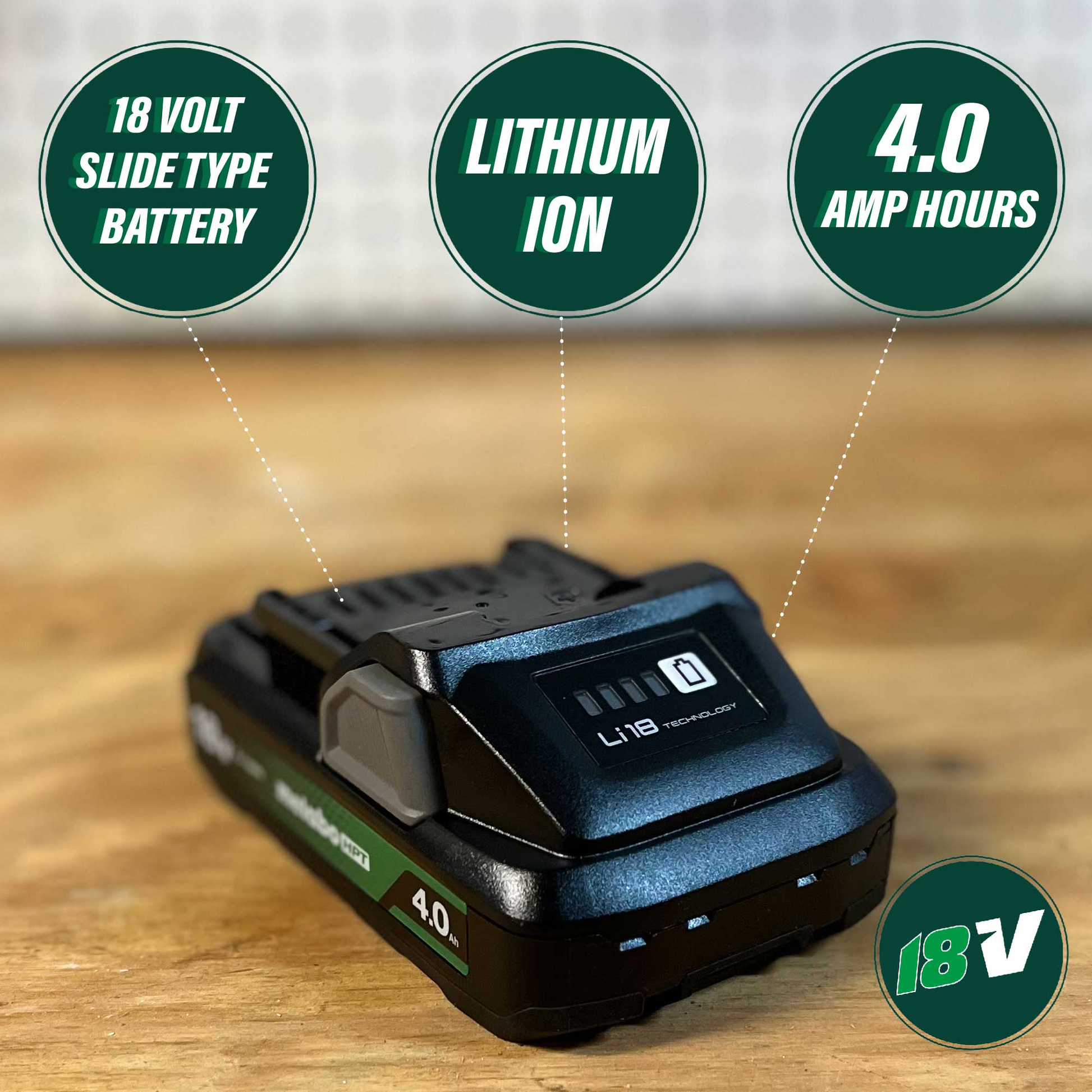A close-up of the Go Build Metabo HPT 378681M BSL1840M 18V 4.0Ah Lithium Ion Battery with fuel indicator, resting on wood with a blurred background.