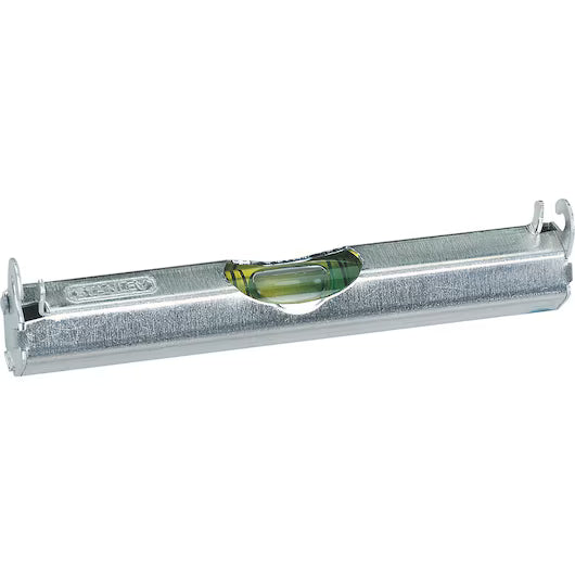 The STANLEY® Aluminium Line Level 80mm is a silver metallic tool with a green liquid-filled vial and two level lines, designed by STANLEY to measure horizontal alignment precisely.