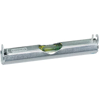 The STANLEY® Aluminium Line Level 80mm is a silver metallic tool with a green liquid-filled vial and two level lines, designed by STANLEY to measure horizontal alignment precisely.