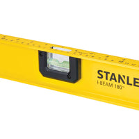 A close-up of a STANLEY 24 in 180° I-Beam Level, a dependable construction tool with a built-in bubble vial and edge ruler markings.