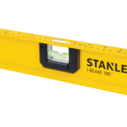 A close-up of the STANLEY 48 in I-Beam 180 Level, a reliable tool for construction, featuring its yellow frame, integrated bubble vial, and clear measurement markings along the top edge.