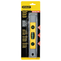 A packaged STANLEY 225 mm (9 in) Magnetic Torpedo Level features three green vials for 90°, 0°, and 45° angles. Yellow-black packaging promotes hands-free use and Contractor Grade details in English and Spanish.