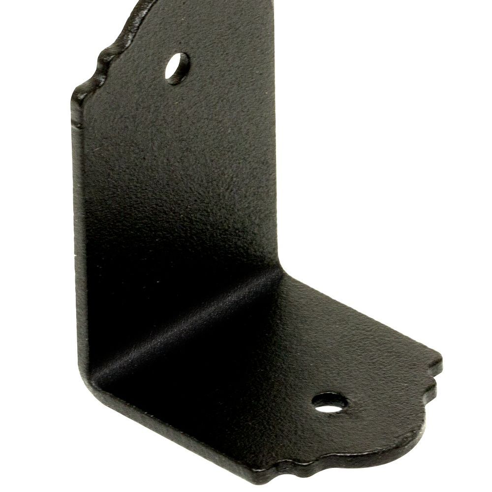 The SIMPSON APA21 APA 90° Angle by Simpson Strong-Tie is a black metal L-bracket with scalloped edges and two holes, perfect for outdoor projects like mounting or securing objects to rafters or beams at a right angle.