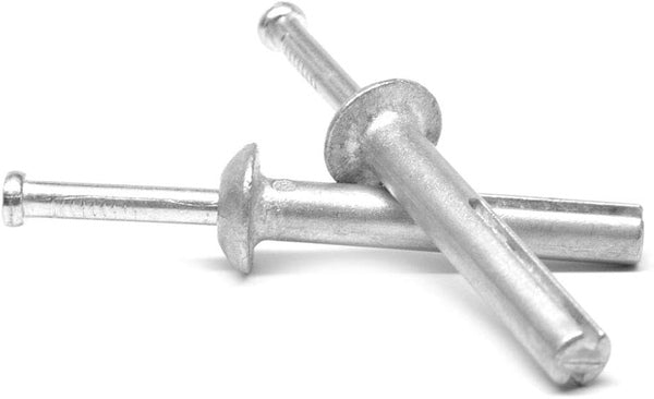 Two Nova Fasteners 1/4 in x 4 in Zinc Hammer Drive Anchors with expansion pins and flat heads are crossed over each other on a white background.