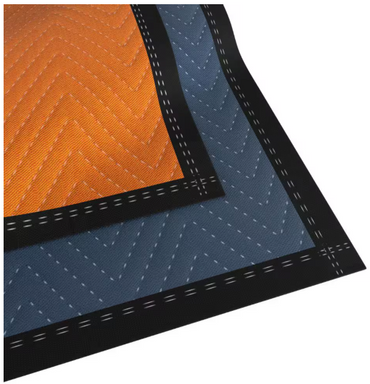 Close-up of two overlapping fabrics resembling the PRATT RETAIL SPECIALTIES Extra-Large Premium Moving Blanket, with an orange top and blue bottom. Both feature a zigzag pattern, black borders, and white stitching, providing stylish damage protection for your belongings.