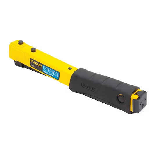 A STANLEY® Heavy-duty Hammer Tacker in yellow and black, designed for tough construction tasks, is shown on a white background.