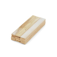 A stack of Go Build 2 in. x 12 in. Wood Shims is neatly arranged on a white background. These split- and rot-resistant spacers are ideal for doors, windows, framing, and DIY projects, featuring a smooth finish with visible grain patterns.