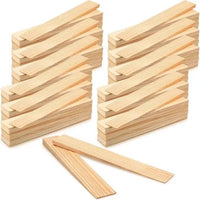 Several stacks of Go Build 2 in. x 12 in. Wood Shims—split-resistant, rot-resistant spacers for doors, windows, framing & DIY projects—are arranged neatly with a few loose shims in front on a white background.