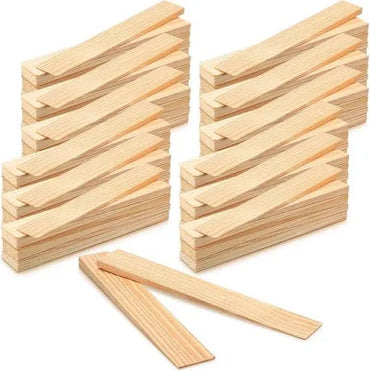 Several stacks of Go Build 2 in. x 12 in. Wood Shims—split-resistant, rot-resistant spacers for doors, windows, framing & DIY projects—are arranged neatly with a few loose shims in front on a white background.