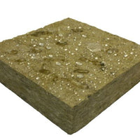 The Owens Corning T3RB451664 ThermaFiber RainBarrier 45 Mineral Wool Insulation by Go Build features a textured surface with blends of tan and gray, accented by small white specs. This fire-resistant product is ideal for continuous insulation needs.