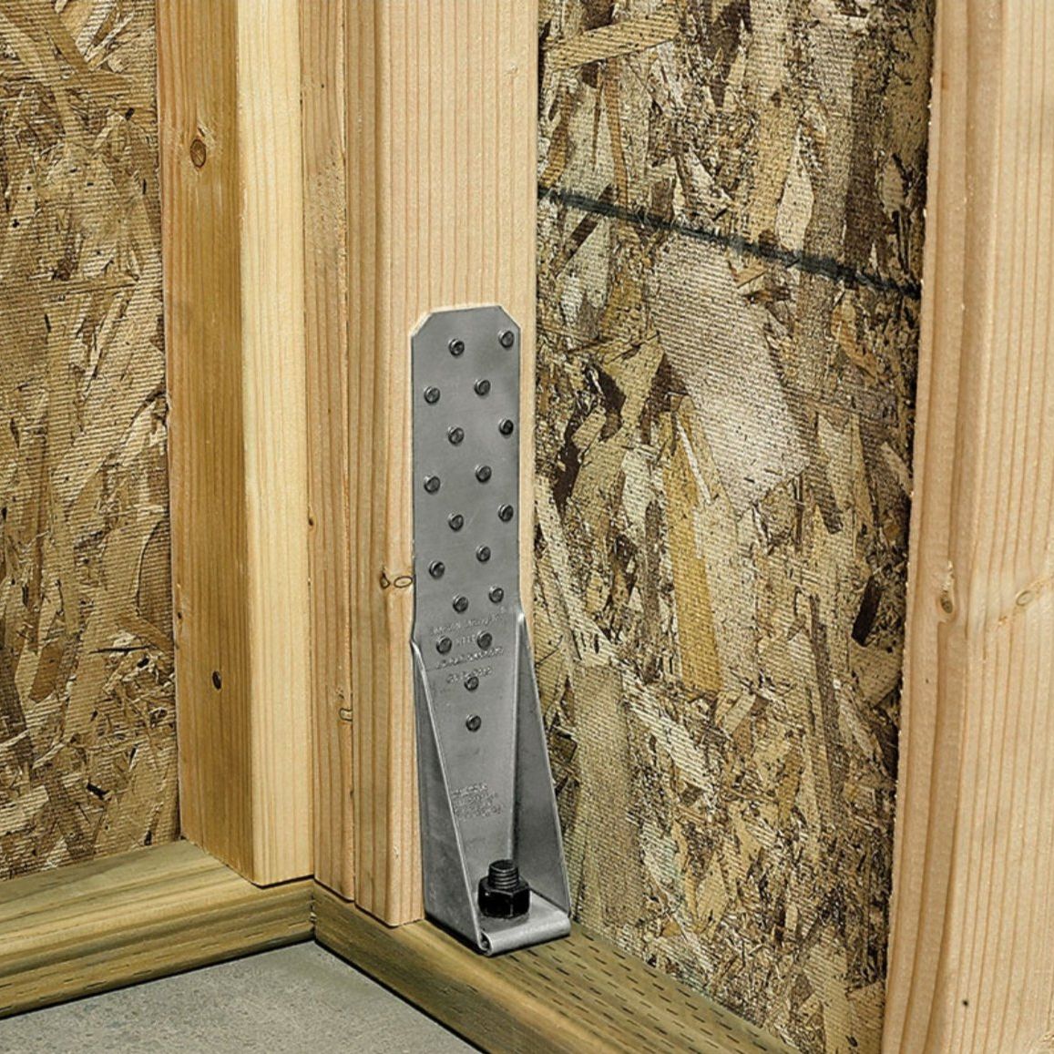 The SIMPSON STRONG-TIE HTT4 12-3/8 in. Galvanized Heavy Tension Tie by Simpson Strong-Tie offers a high-strength solution for connecting wooden beams and chipboard panels, providing powerful structural support. This product, featured in a Simpson Strong-Tie advertisement, emphasizes safety and strength in construction.