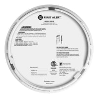 Back view of the FIRST ALERT 1046796 SMCO210 10-Year Battery Combo Smoke and CO Alarm with Slim Profile Design displays the product label, usage instructions, maintenance details, safety warnings, certifications, and manufacturer info.