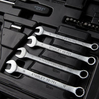 A close-up of the STANLEY 1/4 IN & 3/8 IN DRIVE MECHANIC TOOL SET (145 PC) shows four silver combination wrenches of various sizes, neatly arranged in a black toolkit alongside other tools and accessories.