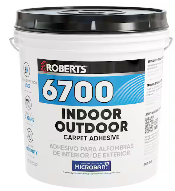 A 4-gallon bucket of ROBERTS Creamy Tan Indoor/Outdoor Carpet and Artificial Grass Adhesive, ideal for installation, featuring blue and black labeling with English and Spanish text plus a Microban logo for antimicrobial protection.