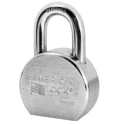 The AMERICAN LOCK A700KD is a round, solid steel padlock in silver with the brand and flag logo engraved. Ideal for industrial security, it features a thick shackle stamped HARDENED on top.
