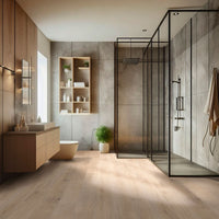 Modern bathroom with wood accents, floating vanity, wall shelves, and a glass-enclosed gray tile shower. MSI Cyrus Chester Hills Luxury Vinyl Planks with 100% waterproof CrystaLux™ protection elevate the bright space.