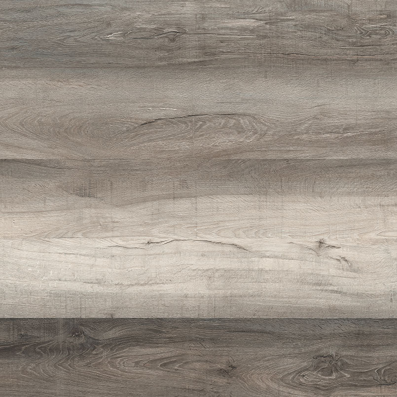 A close-up of the Cyrus Draven Luxury Vinyl Planks by MSI shows gray and brown wood grain with natural variations, knots, and horizontal lines, featuring waterproof CrystaLux protection. (23.77 SQFT per box).